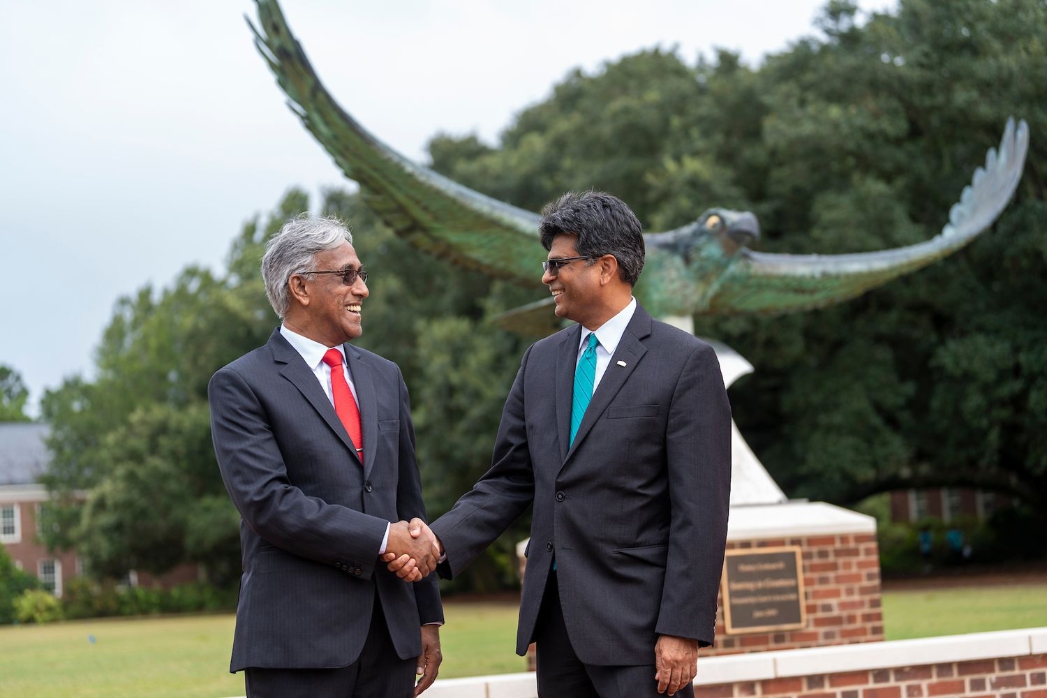Chancellor Aswani Volety signs an international partnering contract with Pro Vice-Chancellor KNS Acharya of GITAM.
